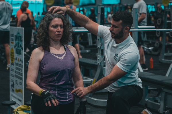 Jay measuring woman's dimensions.