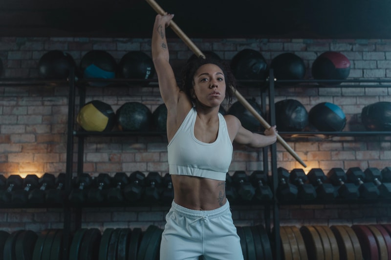 Woman stretching as part of a performance training program.